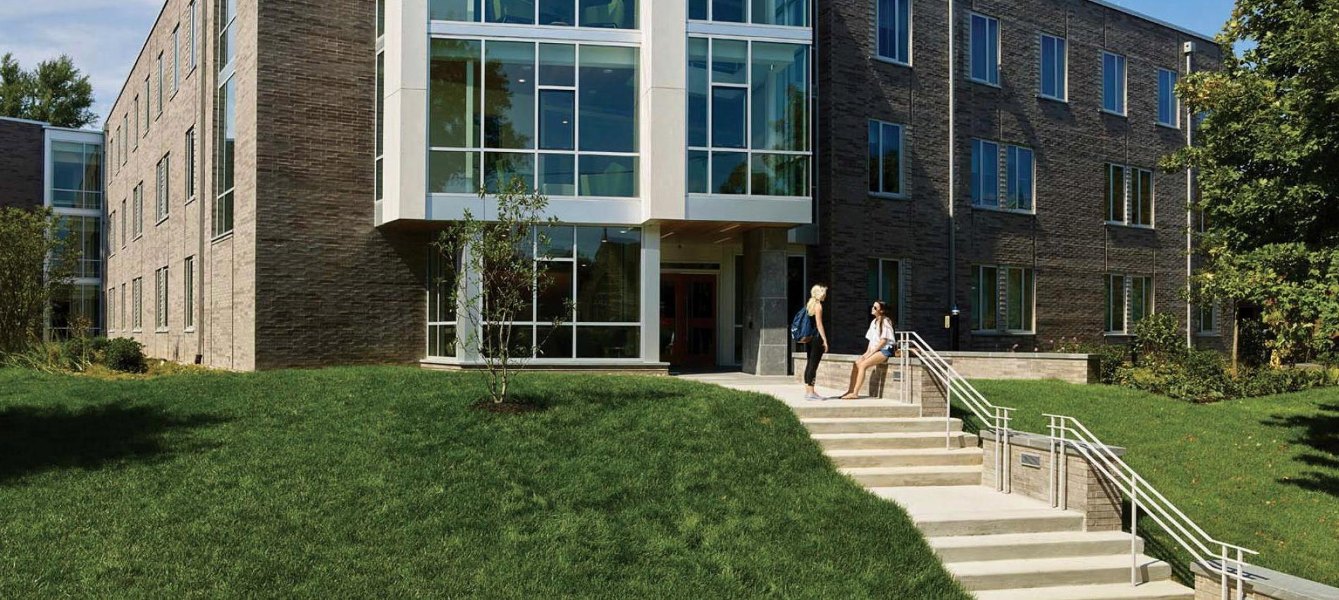 Students sitting outside of New Dorm