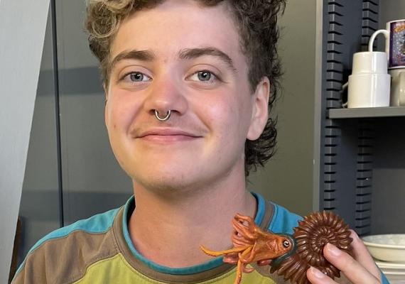 Maya Hofstetter '25 poses with a fossil at her summer internship